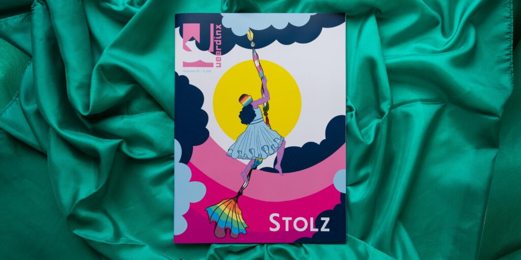 Das Cover der Queerdinx Stolz-Ausgabe auf grünem Stoff